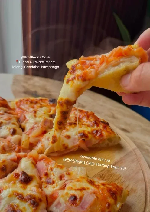 A slice of pizza pulled from the pie